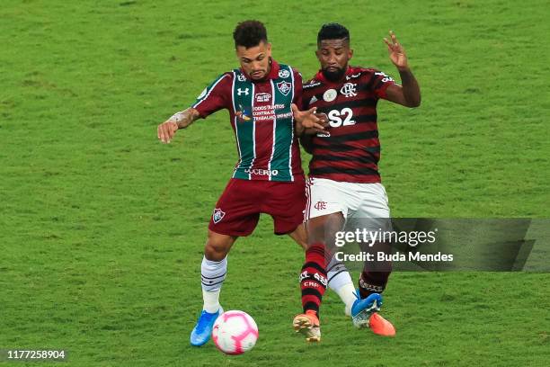 Rodinei of Flamengo struggles for the ball with Wellington Nem of Fluminense during a match between Flamengo and Fluminense as part of Brasileirao...