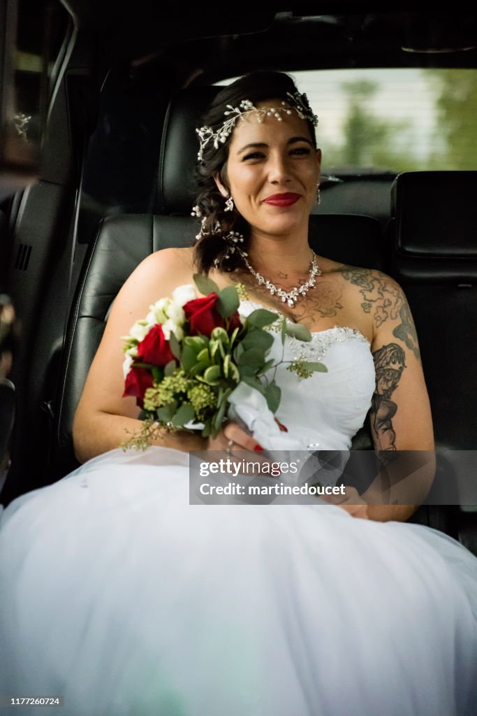 Millennial woman in limousine on her way to wedding.