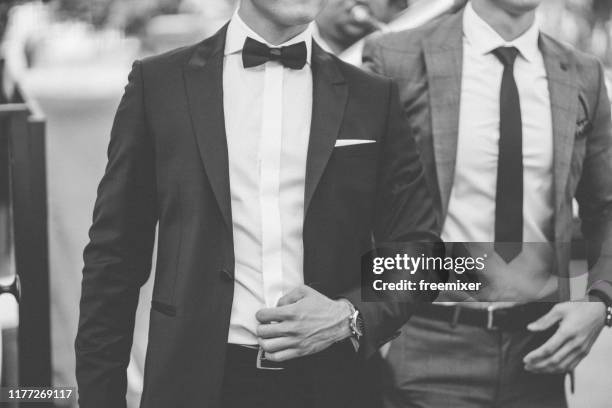 bridegroom and groomsman with musicians at wedding day - dinner jacket man stock pictures, royalty-free photos & images