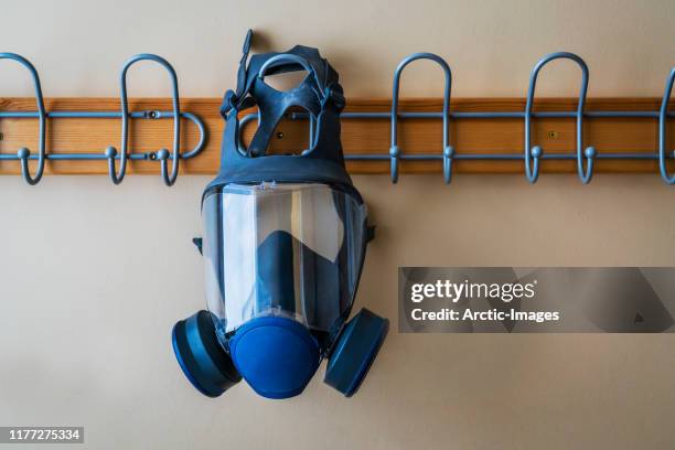 gas mask hanging. - gas mask stock pictures, royalty-free photos & images