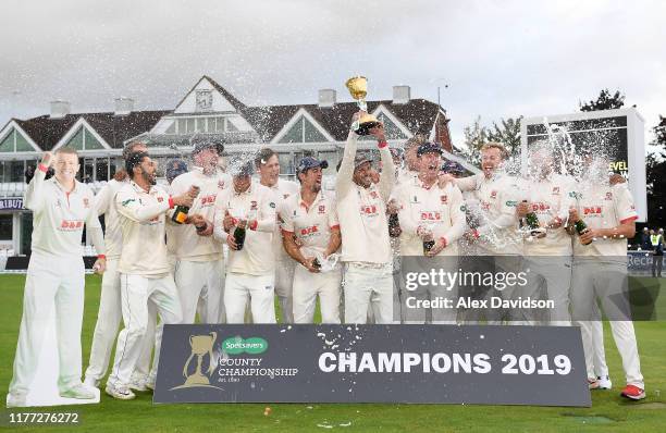 Ryan Ten Doeschate of Essex lifts the Specsavers County Championship Division One Trophy with his teammates during Day Four of the Specsavers County...