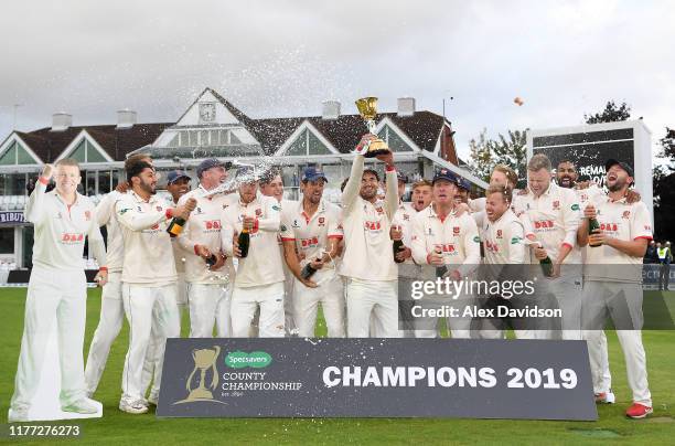 Ryan Ten Doeschate of Essex lifts the Specsavers County Championship Division One Trophy with his teammates during Day Four of the Specsavers County...