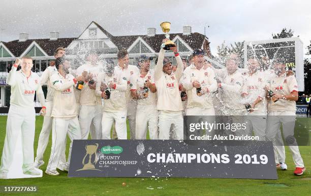 Ryan Ten Doeschate of Essex lifts the Specsavers County Championship Division One Trophy with his teammates during Day Four of the Specsavers County...