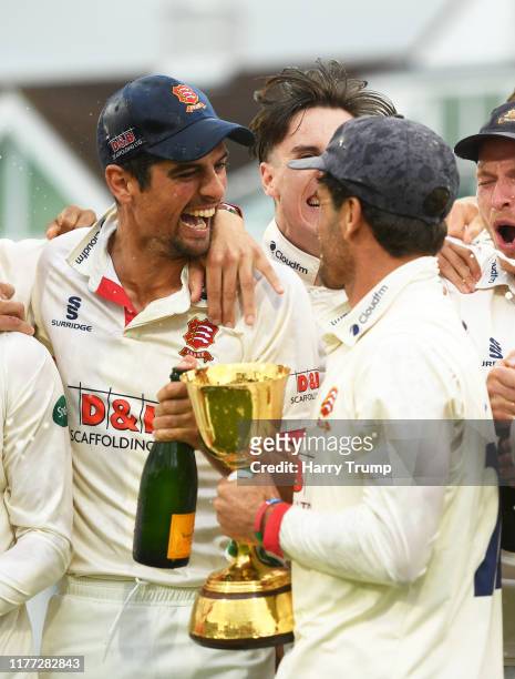 Sir Alastair Cook and Ryan Ten Doeschate of Essex celebrate with the County Championship Trophy during Day Four of the Specsavers County Championship...