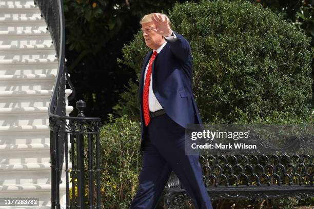 President Donald Trump waves as he returns to the White House after attending the United Nations General Assembly on September 26, 2019 in...