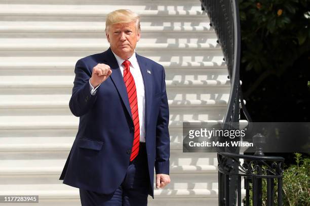 President Donald Trump gestures as he returns to the White House after attending the United Nations General Assembly on September 26, 2019 in...