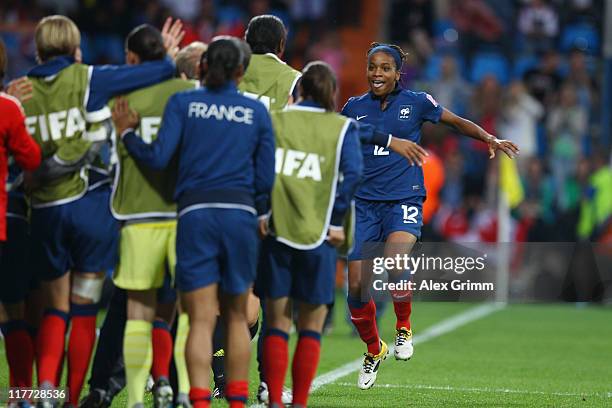 Elodie Thomis of France celebrates her team's fourth goal with team mates during the FIFA Women's World Cup 2011 Group A match between Canada and...