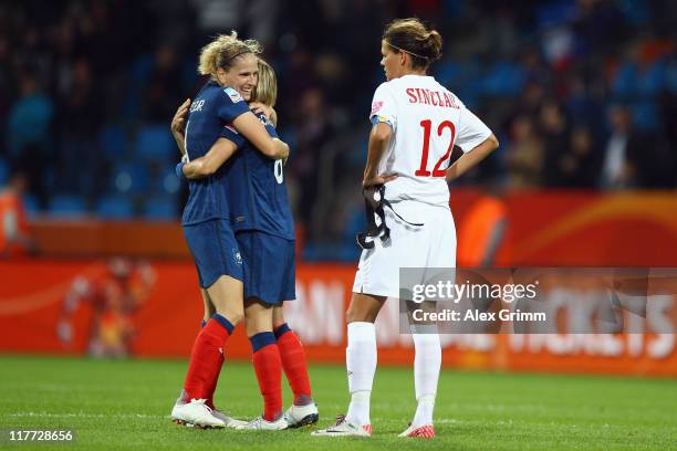Laure Lepailleur and Sonia Bompastor of France celebrate as Christine Sinclair of Canada reacts after the FIFA Women's World Cup 2011 Group A match...