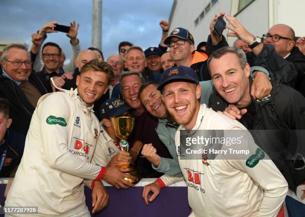 Aaron Beard of Essex and Jamie Porter of Essex celebrate with the crowd after winning the County Championship during Day Four of the Specsavers...
