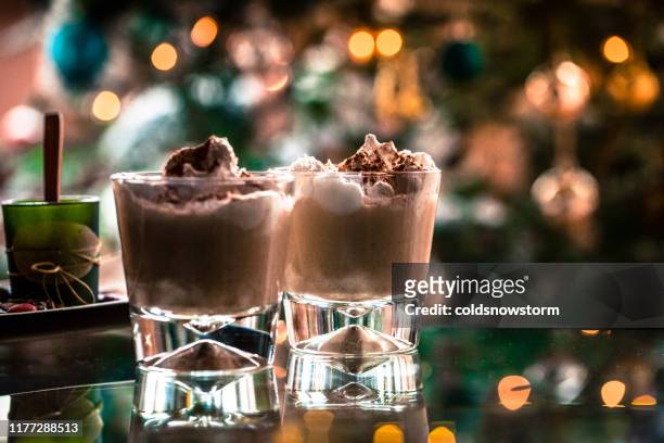fresh christmas eggnog with defocused colorful lights - eggnog stock pictures, royalty-free photos & images