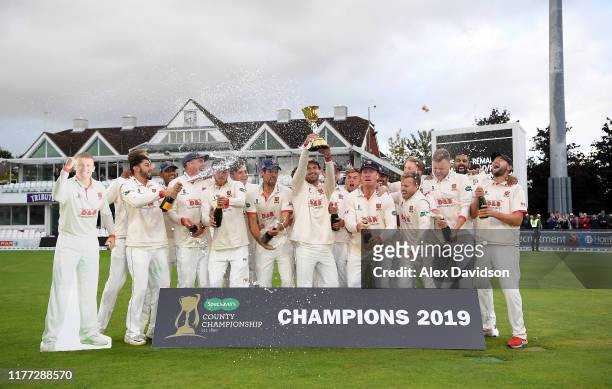 Ryan Ten Doeschate of Essex lifts the Specsavers County Championship Division One Trophy with his teammates during Day Four of the Specsavers County...