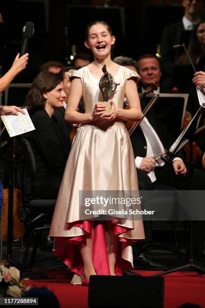 Alma Deutscher with award during the European Cultural Award 'Taurus' at Vienna State Opera on October 20, 2019 in Vienna, Austria.