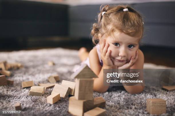 cute baby girl playing with wooden blocks - baby blocks stock pictures, royalty-free photos & images