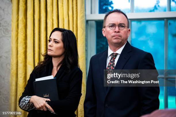 White House Press Secretary Stephanie Grisham and acting White House Chief of Staff Mick Mulvaney listens as President Donald J. Trump meets with...