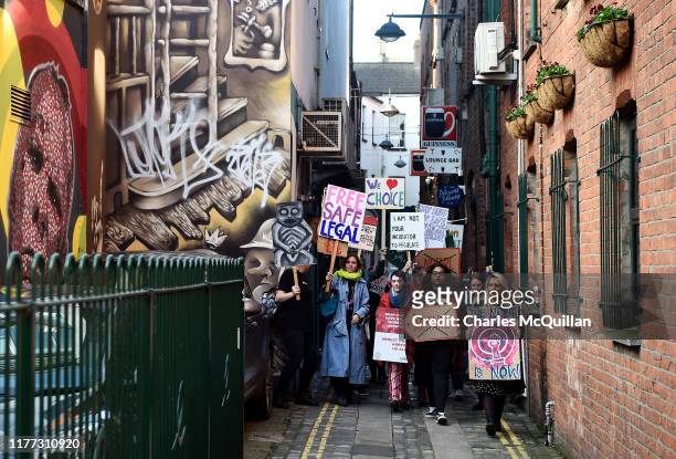 Abortion-rights demonstrators march through the streets of Belfast ahead of a meeting of the Stormont Assembly on abortion rights and gay marriage on...