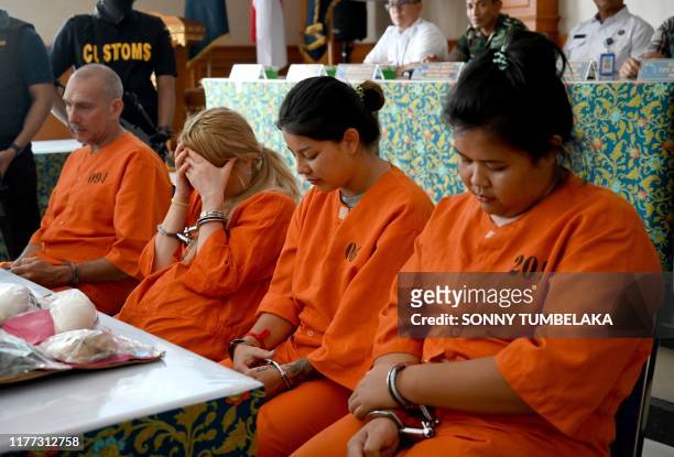 Olivier Jover of France, Tatiana Firsova of Russia, Kasarin Khamkhao and Sanicha maneetes of Thailand attend a press conference at the Customs...