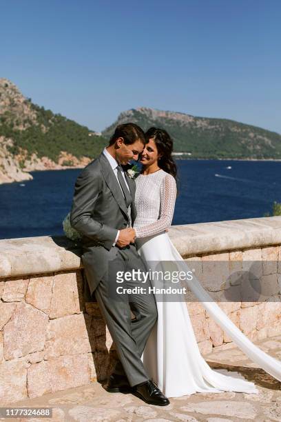 In this handout photo provided by the Fundacion Rafa Nadal, Rafa Nadal poses with wife Xisca Perello for the official wedding portraits after they...