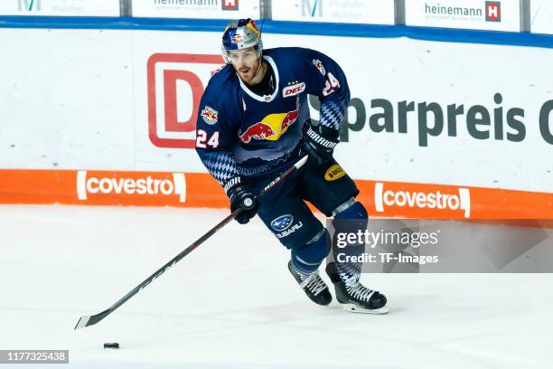 Robert Sanguinetti of EHC Red Bull Muenchen controls the puck during the DEL match between EHC Red Bull Muenchen and Krefeld Pinguine at...