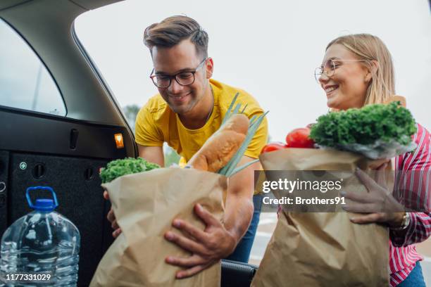 Two People Loading Two People Carrying Load Photos and Premium High Res Pictures - Getty ...