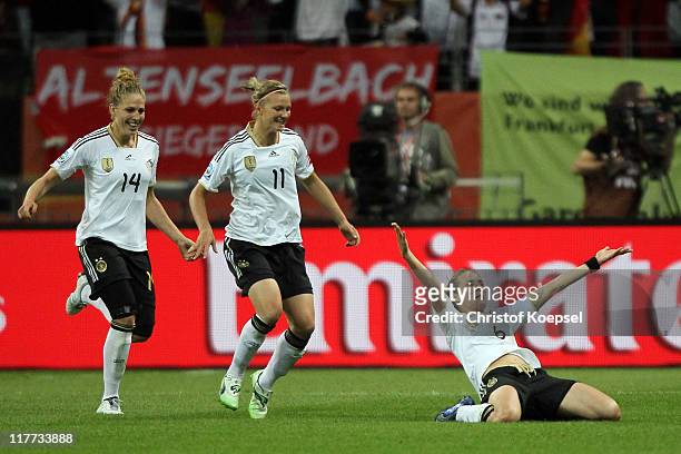 Simone Laudehr of Germany celebrates the first goal with Kim Kulig and Alexandra Popp during the FIFA Women's World Cup 2011 Group A match between...