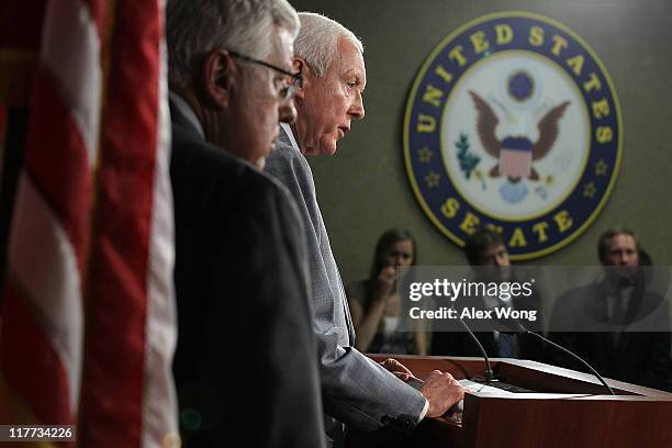 Sen. Orrin Hatch speaks as Sen. Mike Enzi listens during a news conference June 30, 2011 on Capitol Hill in Washington, DC. Senate Republican called...