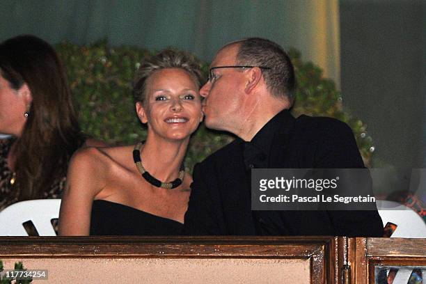 Charlene Wittstock and Prince Albert II of Monaco kiss prior a concert by The Eagles at Louis II Stadium to celebrate the Royal Wedding of Prince...