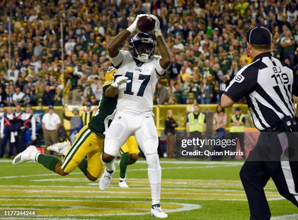 Alshon Jeffery of the Philadelphia Eagles scores a touchdown in the second quarter Jaire Alexander of the Green Bay Packers at Lambeau Field on...