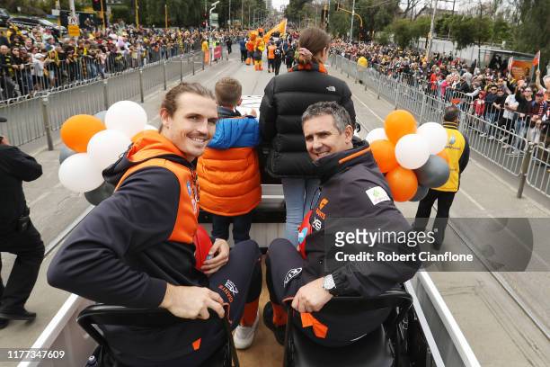 Phil Davis of the GWS Giants and coach Leon Cameron attend the 2019 AFL Grand Final Parade on September 27, 2019 in Melbourne, Australia.