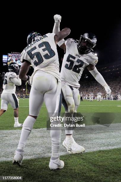 Nigel Bradham and Zach Brown of the Philadelphia Eagles celebrate after Bradham made an interception in the fourth quarter against the Green Bay...