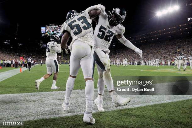 Nigel Bradham and Zach Brown of the Philadelphia Eagles celebrate after Bradham made an interception in the fourth quarter against the Green Bay...