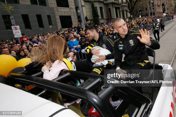 Dustin Martin of the Tigers waves to fans during the 2019 AFL Grand Final Parade on September 27, 2019 in Melbourne, Australia.