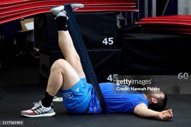 Dane Coles of the All Blacks stretches during a New Zealand gym session on September 27, 2019 in Beppu, Oita, Japan.