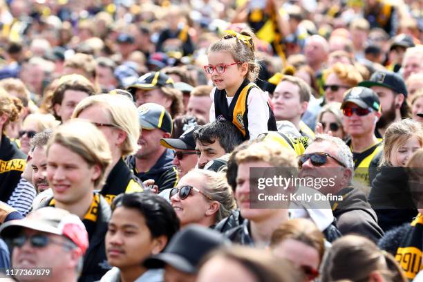 Fans show their support during the 2019 AFL Grand Final Parade on September 27, 2019 in Melbourne, Australia.