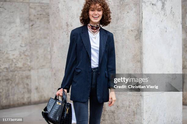 Model is seen wearing scarf outside Paco Rabanne during Paris Fashion Week Womenswear Spring Summer 2020 on September 26, 2019 in Paris, France.