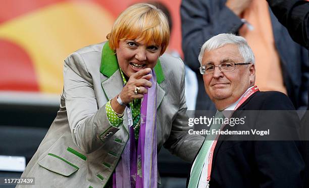 Politician Claudia Roth and Theo Zwanziger of Germany watch the match during the FIFA Women's World Cup 2011 Group A match between Germany and...