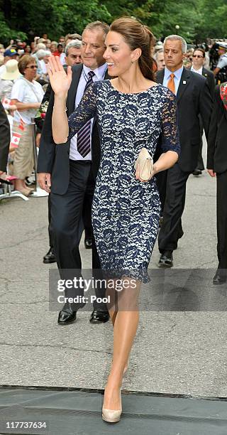 Catherine, Duchess of Cambridge waves to well-wishers as she and Prince William, Duke of Cambridge arrive outside the official residence of the...