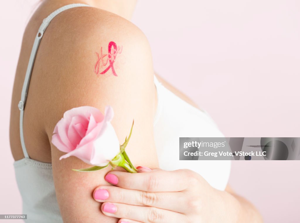 Teenage Girl With Breast Cancer Awareness Ribbon Tattoo On Arm  Bildbanksbilder - Getty Images