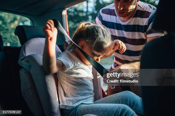 commuting by car - kid car safety stock pictures, royalty-free photos & images
