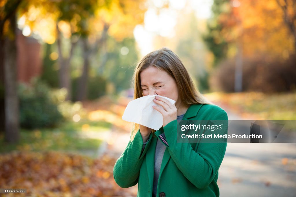 Sick young woman with cold and flu