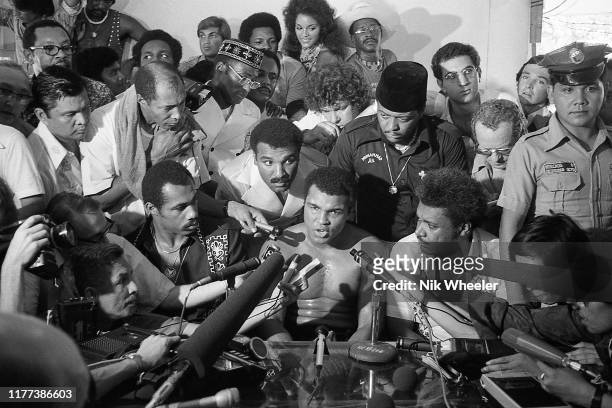 World Heavyweight boxing champion Muhammad Ali speaks to the international press during break in training in gym days before his heavyweight bout...