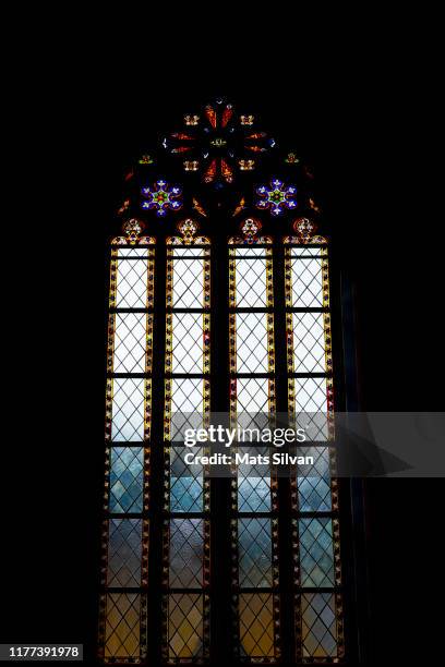 church window with sunlight - christianity black background stock pictures, royalty-free photos & images