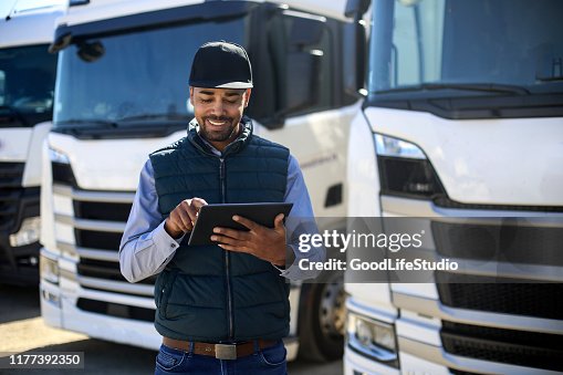 Truck driver using a tablet Truck driver using a tablet