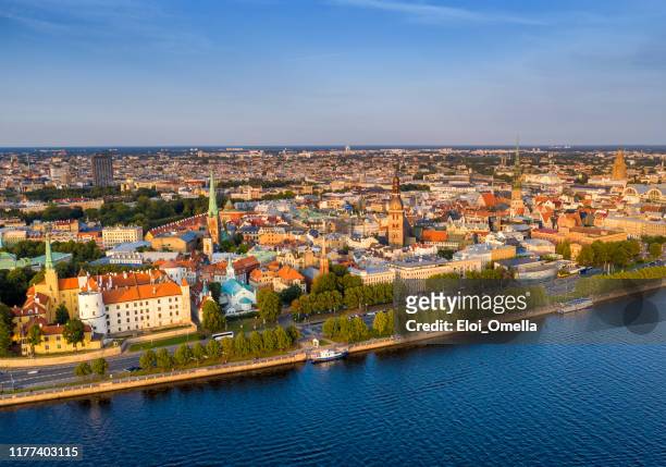 aerial view of riga old town at sunset and northern dvina river. latvia - riga stock pictures, royalty-free photos & images