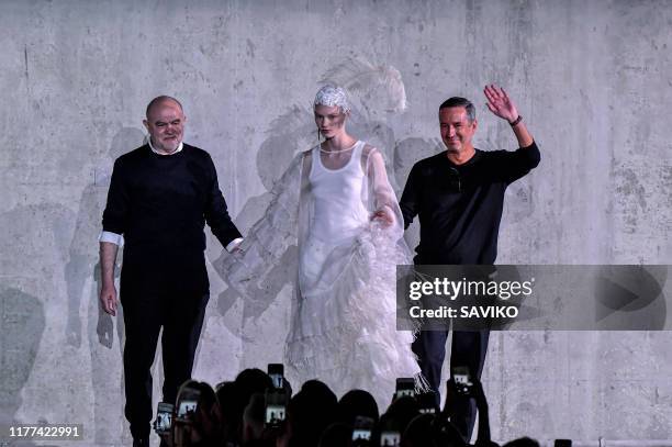 Fashion designers Christian Lacroix and Dries Van Noten walk the runway during the Dries Van Noten ready to Wear Spring/Summer 2020 fashion show as...