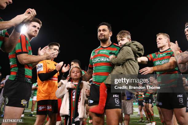 John Sutton of the Rabbitohs is given a guard of honour by his team mates as he walks from the field with his children following the NRL Preliminary...