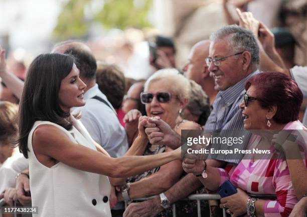 Queen Letizia of Spain is seen greeting a couple during the visit of the Spanish Royals to Arganda del Rey, one of the zones affected by floods on...