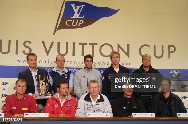 Marcello Bottoli, President and CEO of Louis Vuitton Malletier, holds the Louis Vuitton cup while alongside the nine skippers of the challenging...