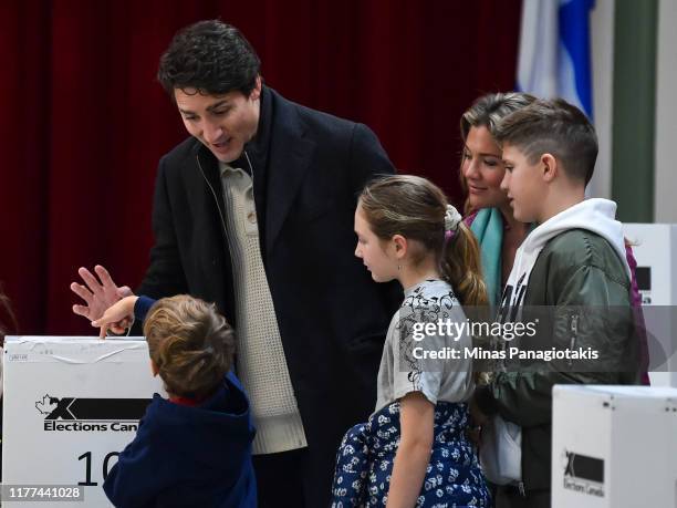 Canadian Prime Minister Justin Trudeau is surrounded by his family as he casts his vote on election day at a polling station on October 21, 2019 in...