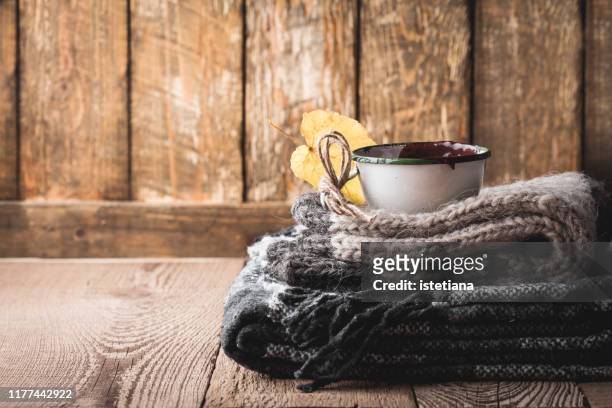 cozy knitted socks, woolen blanket and hot chocolate - wool blanket stock pictures, royalty-free photos & images