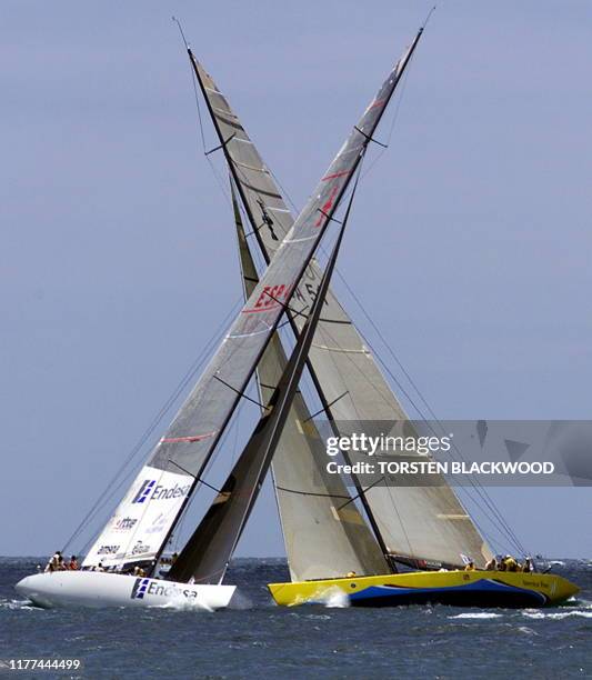 Spanish challenger "Bravo Espana" , skippered by Pedro Campos, tacks in front of "Young America" , skippered by Ed Baird, during the third race of...